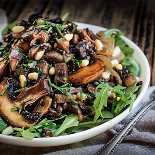 Sauteed oyster and brown mushrooms, black lentils, and caramelized onions are the basis for this lovely fall salad, with pine nuts and capers adding a great flavor boost. | www.viktoriastable.com