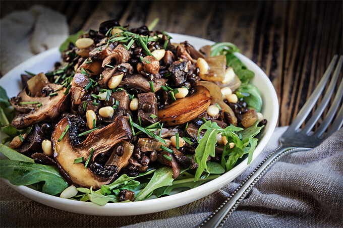 Sauteed oyster and brown mushrooms, black lentils, and caramelized onions are the basis for this lovely fall salad, with pine nuts and capers adding a great flavor boost. | www.viktoriastable.com