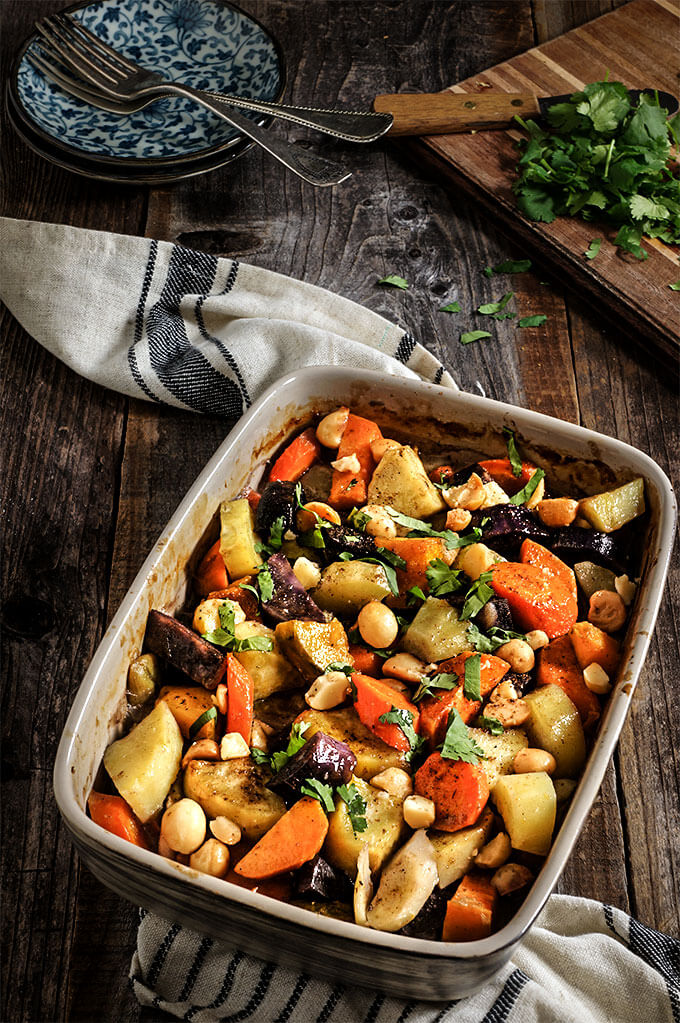 Roasted root vegetables. Cooked in coconut milk, and topped with salty, crunchy macadamia nuts, these are so sweet, creamy and delicious that you will get addicted! You may even skip the pie - they are so good! | www.viktoriastable.com