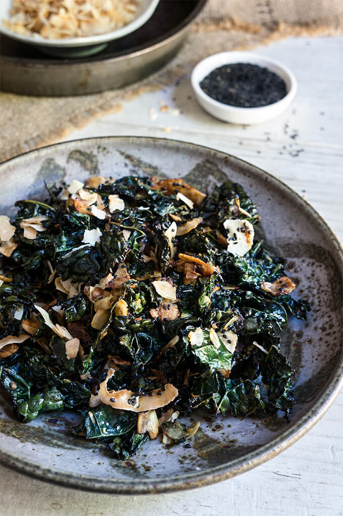 Kale salad with toasted coconut and sesame oil - this fantastic salad has it all - it's crunchy, it's salty, it's satisfying, and feels like comfort food, yet is a health bomb. | www.viktoriastable.com 