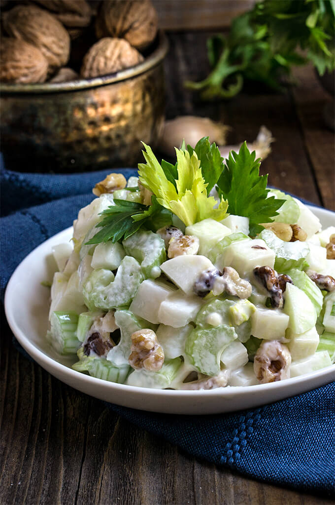 Kohlrabi and celery salad - made with toasted walnuts, and homemade garlic aioli, this simple salad is extra crunchy, delicious and super nutritious, light on calories too! | www.viktoriastable.com