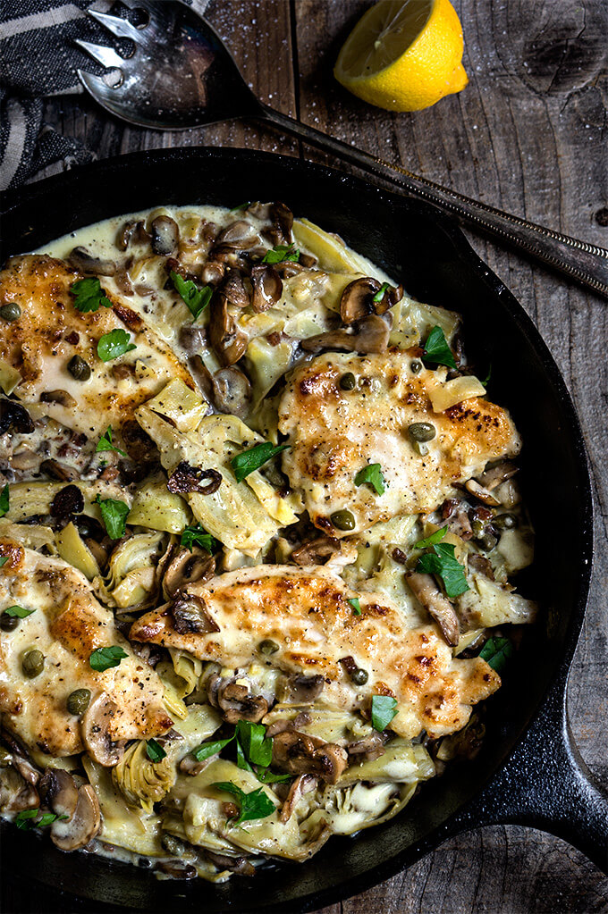 Chicken scallopini with mushrooms and artichokes in a luscious lemon butter sauce - simply divine! | www.viktoriastable.com