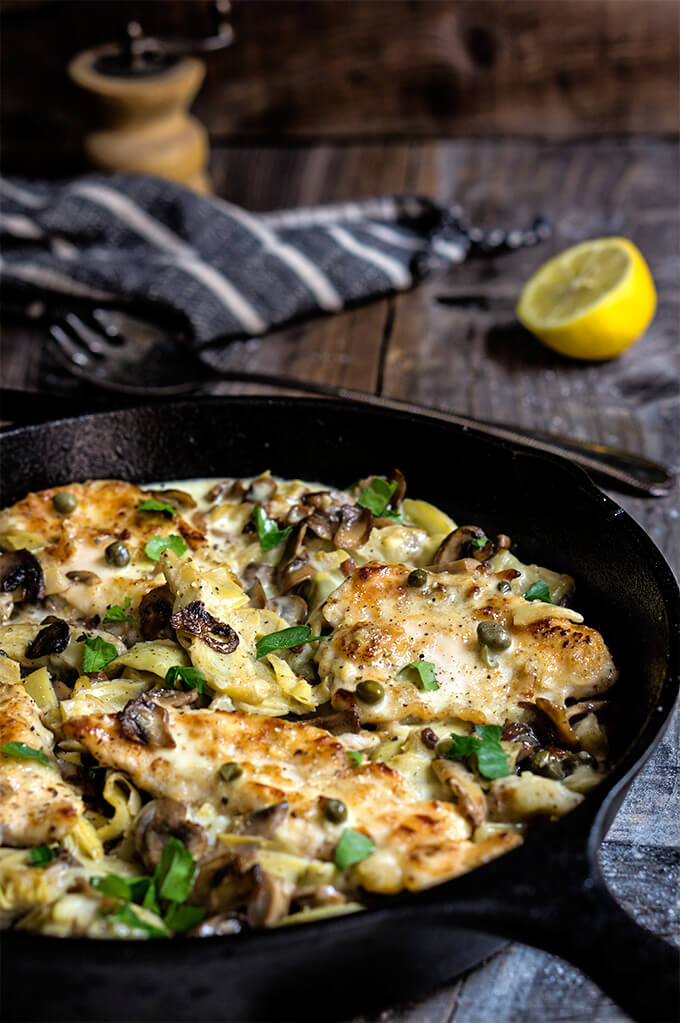 The best chicken scaloppine recipe - sauteed mushrooms and artichokes, smoky pancetta and tangy capers, in luscious lemon butter sauce - simply divine! | www.viktoriastable.com