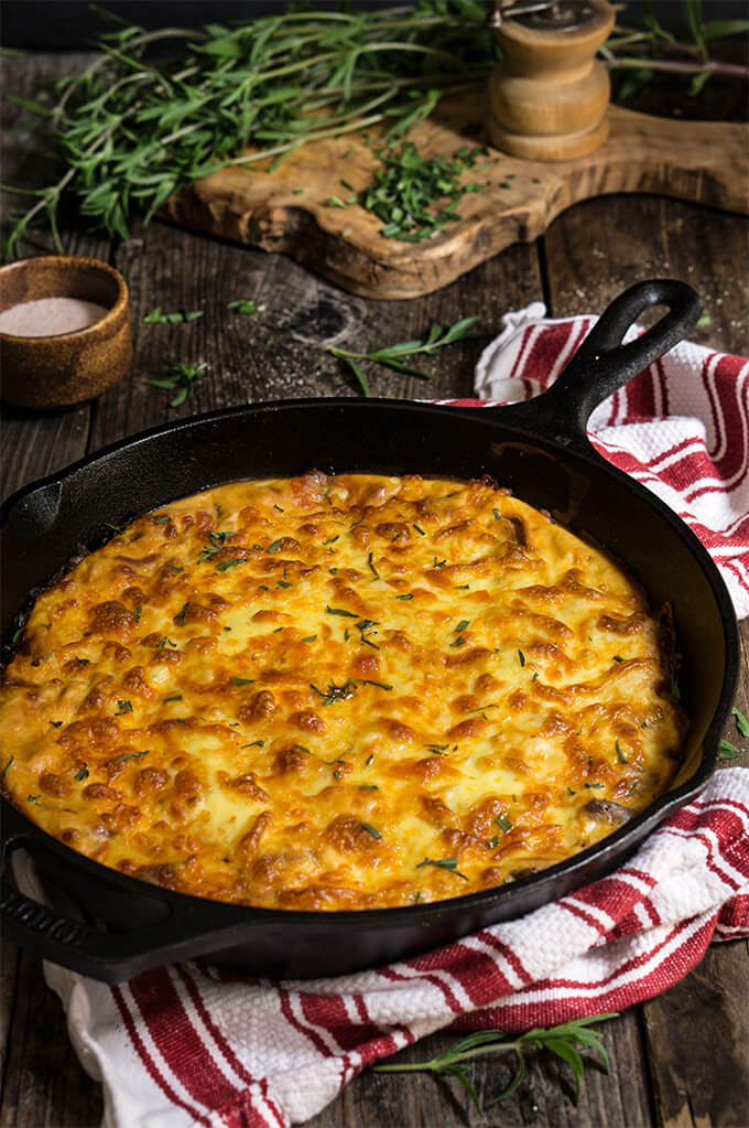 Easy cheesy moussaka - made with potatoes, meat and cheese, this quick version of the famous Greek casserole is a crowd pleaser - elegant and impressive, it's comfort food in its purest. | www.viktoriastable.com