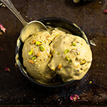 Pistachio rose ice cream - rich, creamy and outrageously delicious, spiked with rose water and cardamom, it's the strongest pistachio flavored ice cream I've tasted, and you can easily make it at home! | www.viktoriastable.com