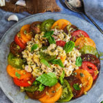 Garlic tuna tomato salad - loaded with aromatic basil and garlic, tangy capers and sharp mustard flavors, this is a super delicious summer salad that works great for a light dinner. | www.viktoriastable.com