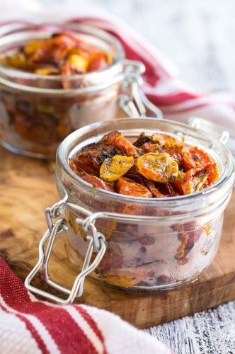 Slow roasted tomatoes - packed with garlic and herb flavors, slightly caramelized and chewy, these tomatoes are so flavorful and versatile, you will want to put them on anything. | www.viktoriastable.com