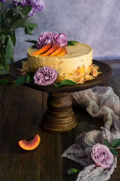 Coconut macaroon peach panna cotta cake - made with coconut cream tangy yogurt, and fresh peaches, this cake is light and fruity, creamy and luxurious - a real summer treat. | www.viktoriastable.com