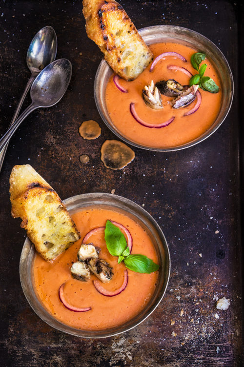 Salmorejo - Spanish creamy tomato and bread soup, served chilled, and topped with smoked sardines, and chopped red onion.| www.viktoriastable.com
