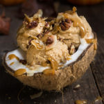 Pumpkin ice cream with coconut caramel and praline pecans - 3 ingredients, no-churn, vegan ice cream that's as creamy and delicious as pumpkin pie, and totally decadent, drizzled with coconut caramel, toasted coconut chips, and maple-spiced praline pecans. | www.viktoriastable.com