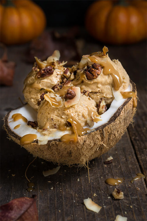 Pumpkin ice cream with coconut caramel and praline pecans - 3 ingredients, no-churn, vegan ice cream that's as creamy and delicious as pumpkin pie, and totally decadent, drizzled with coconut caramel, toasted coconut chips, and maple-spiced praline pecans. | www.viktoriastable.com