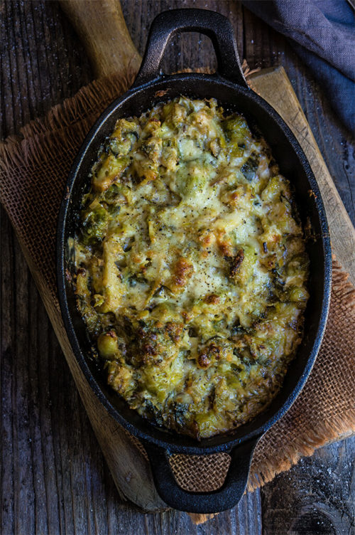Creamy brussles sprouts and leeks - creamy, cheesy, and bursting with flavors of sweet caramelized leeks, garlic and cumin - this recipe is quick, easy and utterly delicious.| www.viktoriastable.com