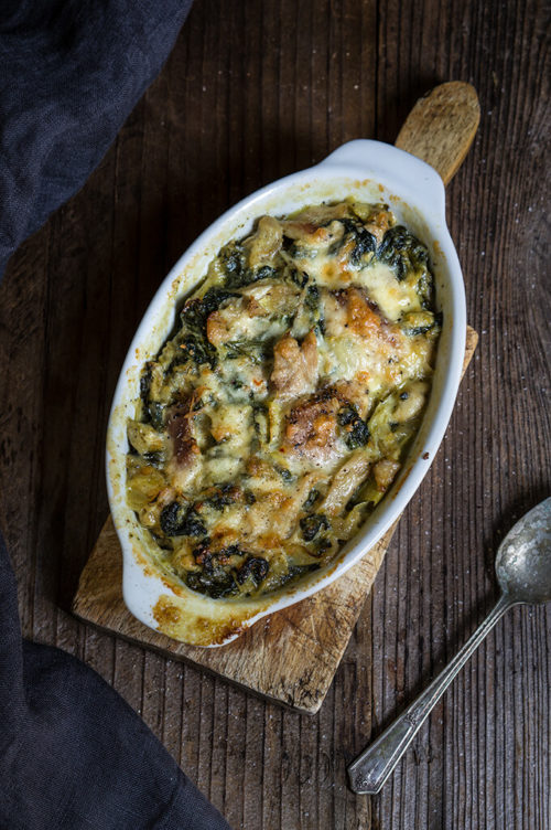 Spinach artichoke chicken casserole - this quick and easy recipe tastes like a cross between spinach artichoke dip, and chicken bake, takes 30 minutes to make, and is a great way to use leftover chicken or Thanksgiving turkey meat. | www.viktoriastable.com