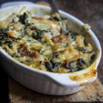 Spinach artichoke chicken casserole - this quick and easy recipe tastes like a cross between spinach artichoke dip, and chicken bake, takes 30 minutes to make, and is a great way to use leftover chicken or Thanksgiving turkey meat. | www.viktoriastable.com