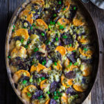 Sweet potato blue cheese gratin - layers of purple and orange sweet potatoes, melting in a pool of spicy cream, and salty blue cheese - this luscious, festive-looking dish will make a bold statement on your Thanksgiving table. | www.viktoriastable.com