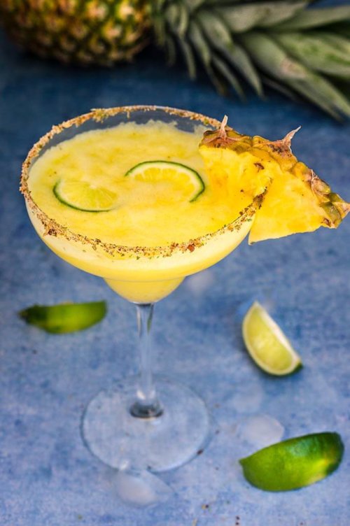Spicy pineapple margarita - icy-cold, with a spicy kick, fruity and refreshing, served with a fragrant rim of chili lime salt, this drink will give you just the right amount of heat and freshness. | www.viktoriastable.com