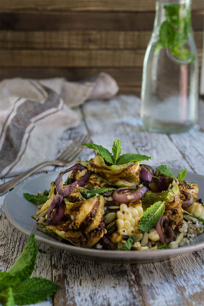 Grilled zucchini and corn quinoa salad - loaded with sweet, grilled summer veggies, healthy quinoa and crunchy toasted pepitas, and bursting with fresh, citrus and mint flavors - so bright, delicious and filling. | www.viktoriastable.com
