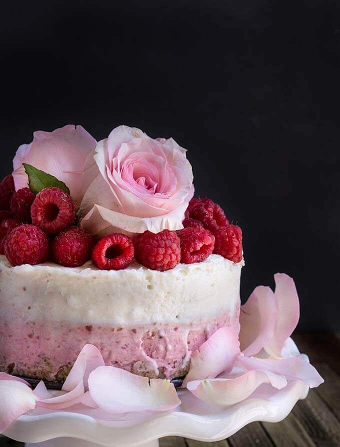 White chocolate coconut raspberry mousse cake - light, delicate, and festive, this no-bake cake is super indulgent, with layers of raspberry mascarpone cheese, and white chocolate coconut mousse on top. | www.viktoriastable.com