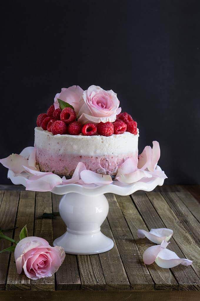 White chocolate coconut raspberry mousse cake - light, delicate, and festive, this no-bake cake is super indulgent, with layers of raspberry mascarpone cheese, and white chocolate coconut mousse on top. | www.viktoriastable.com