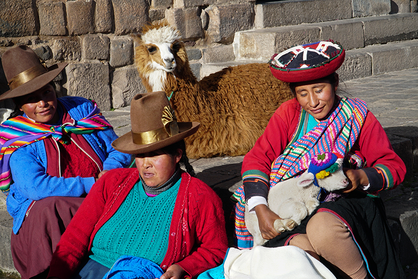 Quechua ladies posing with their llamas - San Blas, Cusco