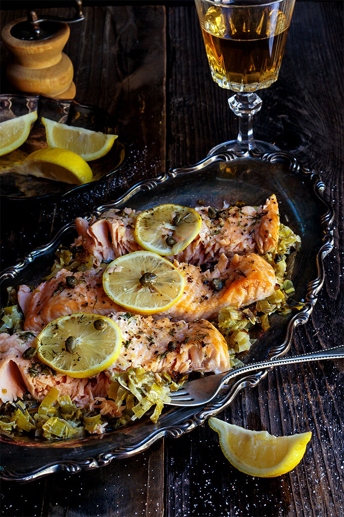 Baked salmon with creamy leeks is a classic and all time favorite recipe - simple, yet absolutely delicious, it's perfect for entertaining, and quick to make! | www.viktoriastable.com