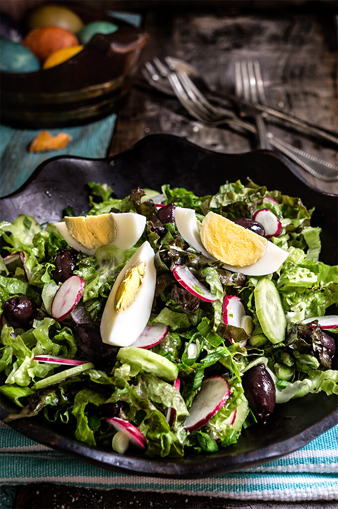 Easter salad - tender lettuce, cucumbers, radishes, green garlic, kalamata olives, boiled eggs - this salad is a celebration of spring at every bite, and a great use of left over Easter eggs. | www.viktoriastable.com