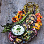 Marinated grilled vegetables with whipped goat cheese - eggplants, peppers, zucchini, asparagus, and onions, marinated and grilled till soft on the inside and charred on the outside, then doused in garlicky marinade, and served with whipped goat cheese on the side. | www.viktoriastable.com