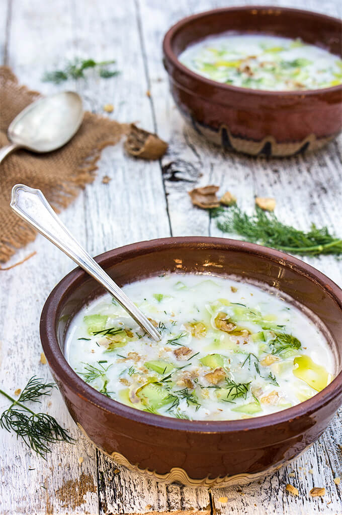 Cold cucumber yogurt soup - garlic, walnuts, dill, fresh cucumbers and chilled yogurt make this soup super delicious and quite refreshing on a hot day. | www.viktoriastable.com