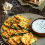 Oven-fried zucchini crisps with garlic yogurt dip - this is a fantastic summer finger food, quick and easy to make, and so delicious you need to triple the recipe! | www.viktoriastable.com