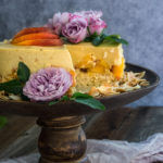 Coconut macaroon peach panna cotta cake - made with coconut cream tangy yogurt, and fresh peaches, this cake is light and fruity, creamy and luxurious - a real summer treat. | www.viktoriastable.com
