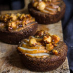 Hazelnut buckwheat pear financiers - made with browned butter and toasted hazelnut meal, topped with juicy pears, and crunchy caramelized hazelnuts, these mini gluten free cakes are moist and buttery, with an irresistible nutty flavor. | www.viktoriastable.com