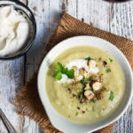 Celery root and leeks soup - creamy and aromatic, served with garlic crème fraiche, toasted spices, hazelnuts, and lots of fresh parsley, this soup is a winter favorite. | www.viktoriastable.com