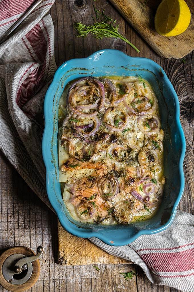 Celery root and smoked salmon gratin - in this creamy dish, aromatic celery root pairs beautifully with smoked fish, red onions and dill-flavored creme fraiche for a quick and easy dinner. | www.viktoriastable.com