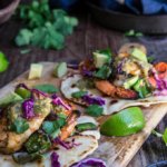 Grilled shrimp tacos with tomatillo salsa and homemade tortillas - bursting with flavor, juicy shrimp, grilled poblano peppers and tomatoes, topped with freshly made salsa verde, and served over soft homemade flour tortillas. | www.viktoriastable.com