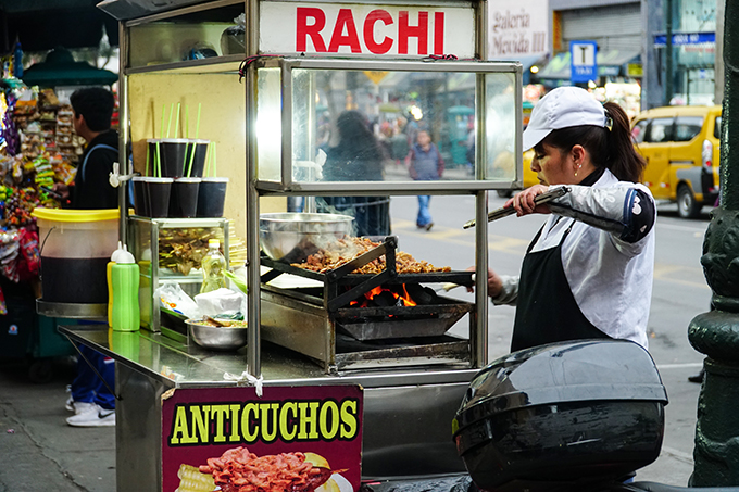 Street food vendor selling anticuchos - Lima, Peru